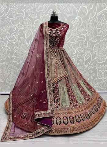 For A Designer Look,Grab These Lehenga Choli With 2 Dupatta in Fine Colored.These Lehenga And Choli Are Velvet And Dupatta Are Fabricated On Soft Net Pair.Its Beautified With Designer Fancy Patch Work,Multy Thread Embroidery,Zarkan Diamond Work.