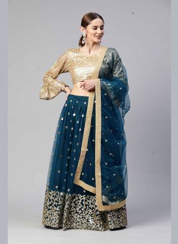 Heavy Designer Lehenga Choli In Golden And Blue Color Fabricated On Net Beautified With Heavy Attractive Embroidery. 