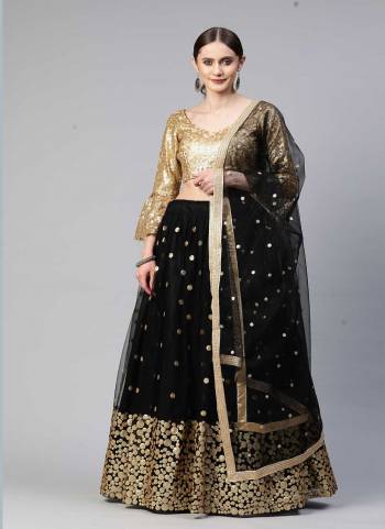 Heavy Designer Lehenga Choli In Golden And Blue Color Fabricated On Net Beautified With Heavy Attractive Embroidery. 