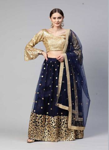 Heavy Designer Lehenga Choli In Golden And Blue Color Fabricated On Net Beautified With Heavy Attractive Embroidery. 