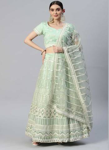 Heavy Designer Lehenga Choli In Pastel Green Color Fabricated On Net Beautified With Heavy Attractive Embroidery. 