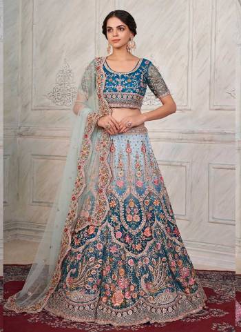 For A Designer Look,Grab These Lehenga Choli in Fine Colored.These Lehenga And Dupatta Are Fabricated On Soft Net Pair With Soft Net Blouse.Its Beautified With Heavy Designer Embroidery Work.