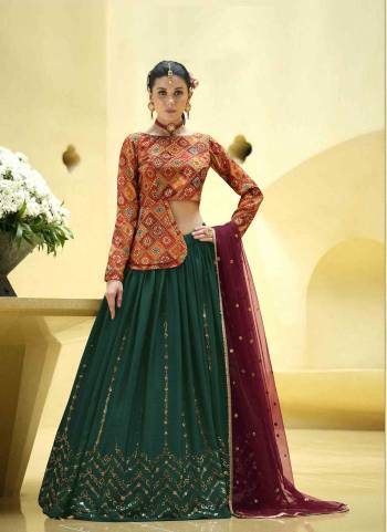 A Designer Look,Grab These Lehenga Choli With Dupatta in Fine Colored.These Lehenga Are Chinon Silk And Blouse Are Fabricated On Art Silk Pair With Net Dupatta.Its Beautified With Designer Printed,Sequance Embroidery Work.