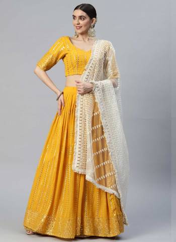 For A Designer Look,Grab These Lehenga Choli in Fine Colored.These Lehenga And Blouse Are Fabricated On Georgette Pair With Net Dupatta.Its Beautified With Sequance,Thread Embroidery Work.