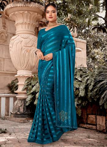 Garb These Saree in Fine Colored.These Saree And Blouse is Art Silk Fabricated Pair.Its Beautified Fabric With Wevon Patta Designer With Swarovski Work.