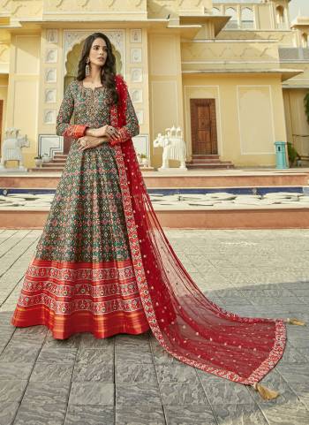 For A Designer Look,Grab These Readymade Gown With Dupatta in Fine Colored.These Gown Are Fabricated On Cherry Silk Pair With Net Dupatta.Its Beautified With Designer Patola Printed With Embroidery Work.