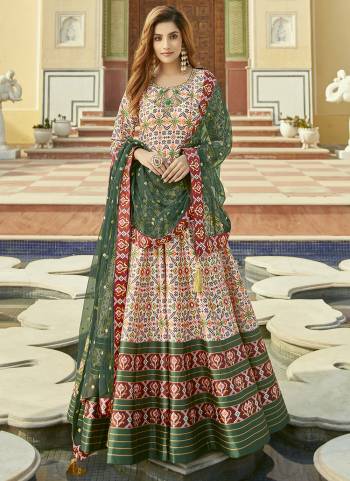 For A Designer Look,Grab These Readymade Gown With Dupatta in Fine Colored.These Gown Are Fabricated On Cherry Silk Pair With Net Dupatta.Its Beautified With Designer Patola Printed With Embroidery Work.