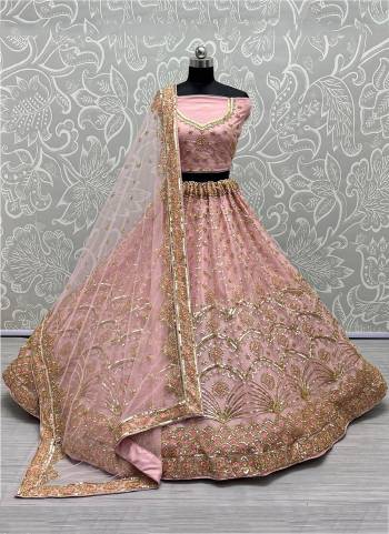 For A Designer Look,Grab These Lehenga Choli With Dupatta in Fine Colored.These Lehenga And Choli Are Bridal Net And Dupatta Are Fabricated On Soft Net Pair.Its Beautified With Designer Fancy Multy Thread,Sequance Embroidery With Hand Work.