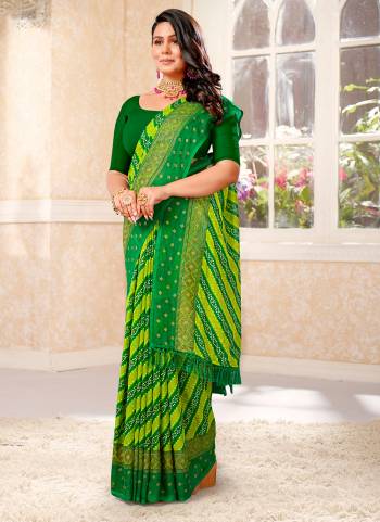 Garb These Saree in Fine Colored.These Saree And Blouse is Renial  Fabricated Pair.Its Beautified Fabric With Bandhani Designer Printed.