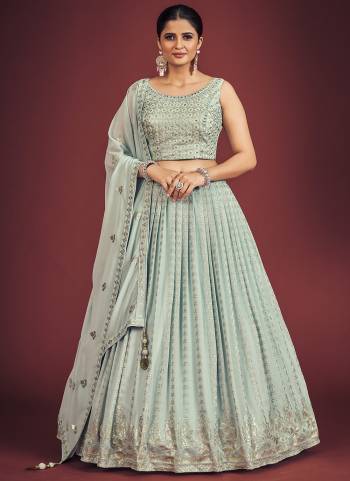 For A Designer Look,Grab These Readymade Lehenga Choli in Fine Light Colored.These Lehenga And Blouse Are Fabricated On Georgette Pair With Georgette Dupatta.Its Beautified With Designer Heavy Sequance,Mirror Embroidery Work.