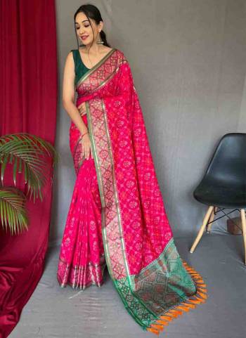 Garb This Partywear Saree Paired With Contrast Blouse.This Saree And Blouse Are Patola Silk Based Fabric With Weaving Jacquard Designer. Buy This Pretty Saree Now.