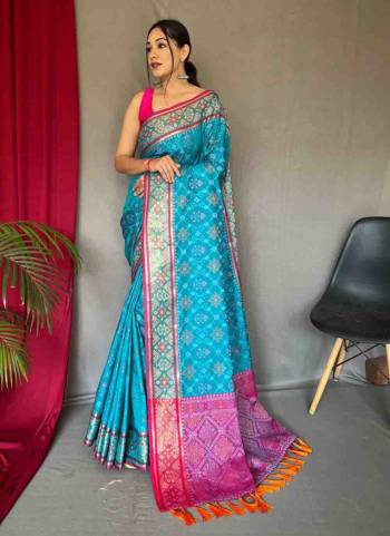 Garb This Partywear Saree Paired With Contrast Blouse.This Saree And Blouse Are Patola Silk Based Fabric With Weaving Jacquard Designer. Buy This Pretty Saree Now.