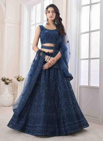 For A Designer Look,Grab These Lehenga Choli in Fine Colored.These Lehenga And Choli Are Fabricated On Soft Net Pair With Soft Net Dupatta.Its Beautified With Heavy Designer Embroidery,Stone Work.