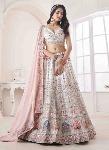 For A Designer Look,Grab These Lehenga Choli in Fine Colored.These Lehenga And Choli Are Fabricated On Georgette Pair With Soft Net Dupatta.Its Beautified With Heavy Designer Embroidery,Stone Work.