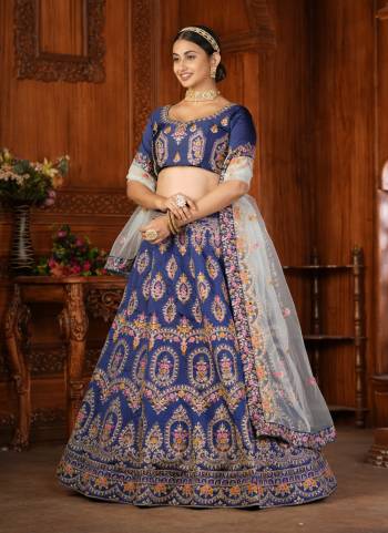 For A Designer Look,Grab These Lehenga Choli in Fine Colored.These Lehenga Choli Are Taffeta Silk And Dupatta Are Fabricated On Net Pair.Its Beautified With Fancy Designer Thread Embroidery Work.