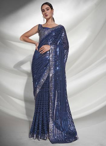 Grab These Party Wear Saree in Fine Colored.These Saree is Fabricated On Georgette Pair With Art Silk Blouse.Its Beautified With Heavy Sequance Embroidery Work.