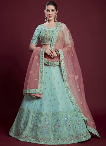 For A Designer Look,Grab These Lehenga Choli in Fine Colored.These Lehenga And Blouse Are Fabricated On Georgette Pair With Soft Net Dupatta.Its Beautified With Designer Heavy Embroidery Work.