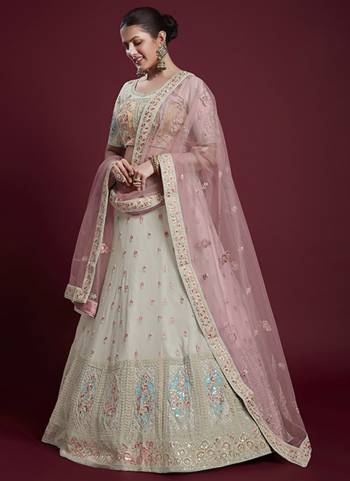 For A Designer Look,Grab These Lehenga Choli in Fine Colored.These Lehenga And Blouse Are Fabricated On Georgette Pair With Soft Net Dupatta.Its Beautified With Designer Heavy Embroidery Work.