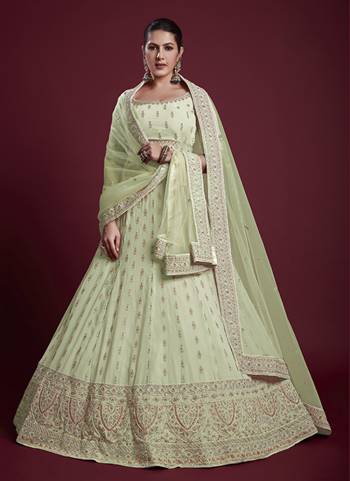 For A Designer Look,Grab These Lehenga Choli in Fine Colored.These Lehenga And Blouse Are Fabricated On Georgette Pair With Soft Net Dupatta.Its Beautified With Designer Heavy Embroidery Work.