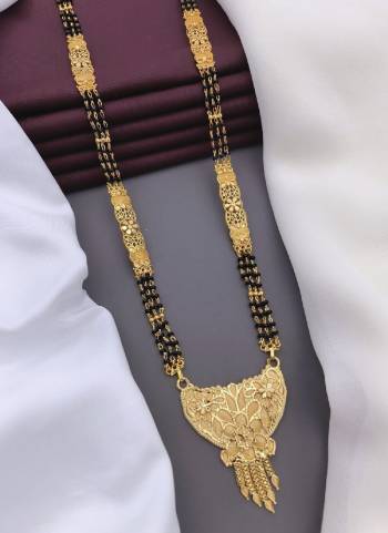 Grab These Beautifil Golden Colored Mangalsutra.These Earring is Come Mazzak Material And Beautified With Temple Work.