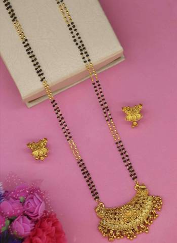 Grab These Beautifil Golden Colored Mangalsutra.These Earring is Come Mazzak Material And Beautified With Temple Work.