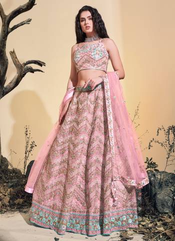 For A Designer Look,Grab These Lehenga Choli in Fine Colored.These Lehenga And Blouse Are Fabricated On Soft Net Pair With Soft Net Dupatta.Its Beautified With Heavy Thread Embroidery,Zarkan Stone Work.