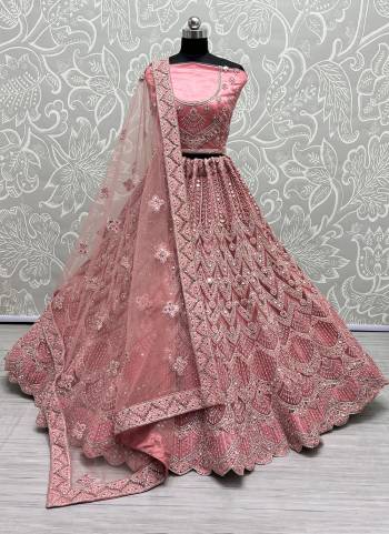 For A Designer Look,Grab These Lehenga Choli With Dupatta in Fine Colored.These Lehenga And Choli Are Bridal Net And Dupatta Are Fabricated On Soft Net Pair.Its Beautified With Designer Fancy Multy Thread,Mirror,Dori Embroidery,Diamond Work.