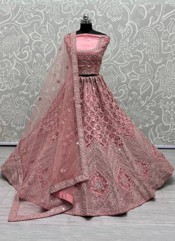 For A Designer Look,Grab These Lehenga Choli With Dupatta in Fine Colored.These Lehenga And Choli Are Bridal Net And Dupatta Are Fabricated On Soft Net Pair.Its Beautified With Designer Fancy Multy Thread,Mirror,Dori Embroidery,Diamond Work.