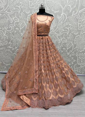 For A Designer Look,Grab These Lehenga Choli With Dupatta in Fine Colored.These Lehenga And Choli Are Bridal Net And Dupatta Are Fabricated On Soft Net Pair.Its Beautified With Designer Fancy Multy Thread,Dori Embroidery,Heavy Zarkan Diamond Work.