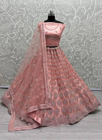 For A Designer Look,Grab These Lehenga Choli With Dupatta in Fine Colored.These Lehenga And Choli Are Bridal Net And Dupatta Are Fabricated On Soft Net Pair.Its Beautified With Designer Fancy Multy Thread,Dori Embroidery,Heavy Zarkan Diamond Work.