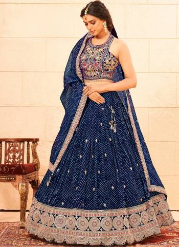 For A Designer Look,Grab These Lehenga Choli in Fine Colored.These Lehenga And Blouse Are Fabricated On Faux Georgette Pair With Faux Georgette Dupatta.Its Beautified With Heavy Designer Embroidery Work.