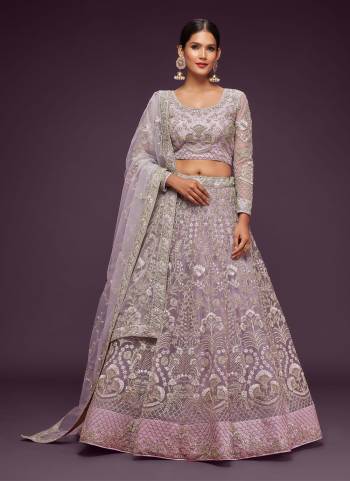 For A Designer Look,Grab These Lehenga Choli in Fine Colored.These Lehenga And Dupatta Are Fabricated On Soft Net Pair With Soft Net Blouse.Its Beautified With Designer Thread,Jari,Dori,Badla Embroidery Work.