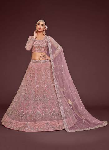 For A Designer Look,Grab These Lehenga Choli in Fine Colored.These Lehenga And Dupatta Are Fabricated On Soft Net Pair With Soft Net Blouse.Its Beautified With Designer Thread,Jari,Dori,Badla Embroidery Work.