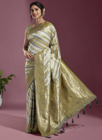 Grab These Party Wear Saree in Fine Colored.These Saree And Blouse is Fabricated On Satin Silk.Its Beautified With Wevon Laheriya Designer Work.