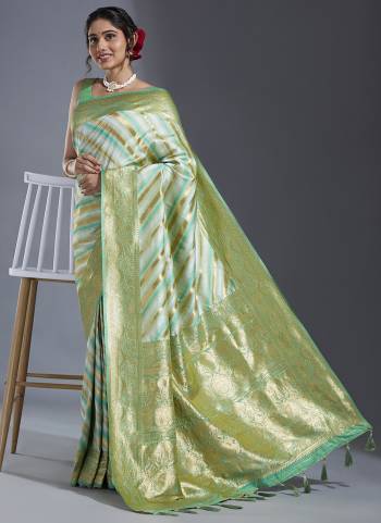 Grab These Party Wear Saree in Fine Colored.These Saree And Blouse is Fabricated On Satin Silk.Its Beautified With Wevon Laheriya Designer Work.