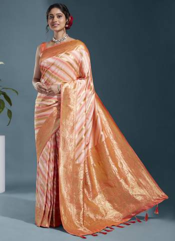 Grab These Party Wear Saree in Fine Colored.These Saree And Blouse is Fabricated On Satin Silk.Its Beautified With Wevon Laheriya Designer Work.