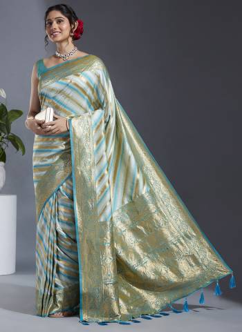 Grab These Party Wear Saree in Fine Colored.These Saree And Blouse is Fabricated On Satin Silk.Its Beautified With Wevon Laheriya Designer Work.