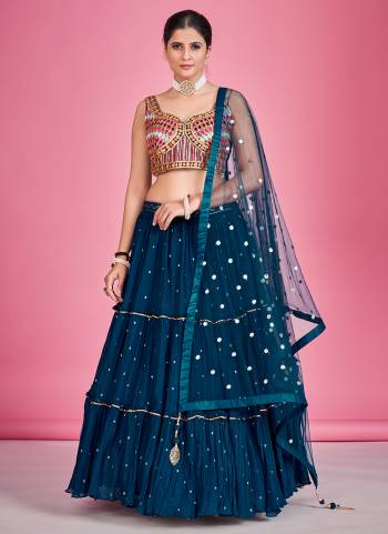 For A Designer Look,Grab These Lehenga Choli in Fine Colored.These Lehenga And Blouse Are Fabricated On Georgette Pair With Soft Net Dupatta.Its Beautified With Thread,Mirror,Sequance Embroidery Work.