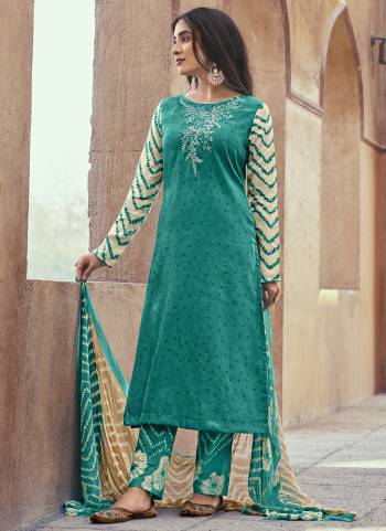 Looking These Suit in Fine Colored Pair With Bottom And Dupatta.These Top Are Cotton Satin And Dupatta Are Fabricated On Cotton Mal Pair With Cambric Cotton Bottom.Its Beautified With Designer Printed With Embroidery Work.