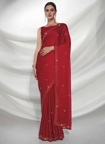 Grab These Party Wear Saree in Fine Colored.These Saree is Fabricated On Satin Chiffon Pair With Art Silk Blouse.Its Beautified With Heavy Swarovski Work.