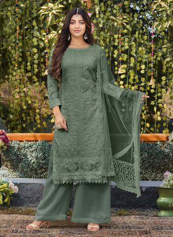 Attrective Looking These Plazzo Suit in Fine Colored Pair With Bottom And Dupatta.These Top And Bottom Are Faux Georgette And Dupatta Are Fabricated On Net Pair.Its Beautified With Heavy Designer Cotton Thread Embroidery Work.