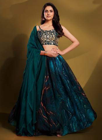 For A Designer Look,Grab These Lehenga Choli in Fine Colored.These Lehenga Are Organza And Blouse Are Fabricated On Art Silk Pair With Crepe Dupatta.Its Beautified With Thread,Sequance,Jari Embroidery Work.