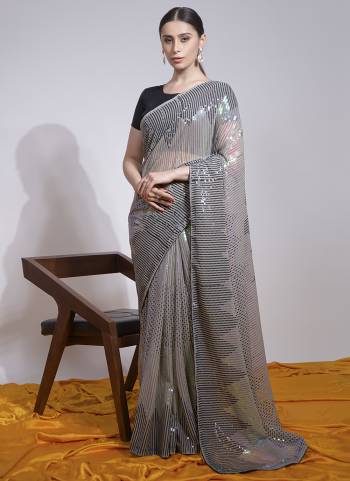 Attrective Look These Saree in Fine Colored.These Saree Are Georgette And Blouse is Mono Banglori Fabricated.Its Beautified With Designer Sequance Embroidery Work.