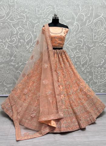 For A Fancy Designer Look,Grab These Lehenga Choli With Dupatta in Fine Colored.These Lehenga And Choli Are Heavy Net And Dupatta Are Fabricated On Soft Net Pair.Its Beautified With Designer Fancy Multy Thread,Dori Embroidery,Zarkan Diamond Work.