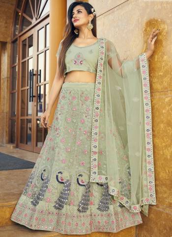 Garb This Partywear Fine Color Heavy Designer Lehemga Choli Fabric Are Soft Net And And Dupatta Soft Net In Fabricated Beautified With Attrective Reaham,Real Mirror Embroidery,Diamond Work. Buy Now.