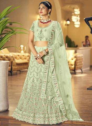 Garb This Partywear Fine Color Heavy Designer Lehemga Choli Fabric Are Soft Net And And Dupatta Soft Net In Fabricated Beautified With Attrective Reaham Embroidery,Diamond Work. Buy Now.