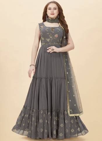 Attrective Looking These Designer Gown in Fine Colored Pair With Dupatta.These Gown Are Faux Georgette And Dupatta Are Fabricated On Net Pair.Its Beautified With Heavy Designer Embroidery,Hand Work.