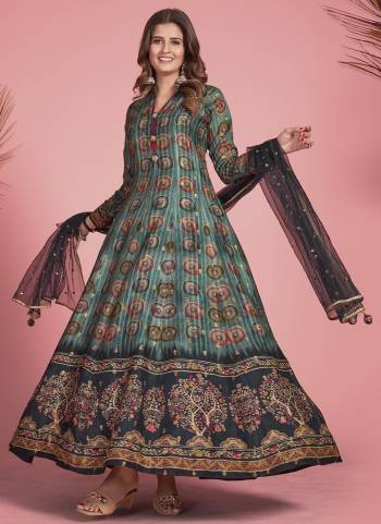 For A Designer Look,Grab These Readymade Gown With Dupatta in Fine Colored.These Gown Are Fabricated On Dola Silk Pair With Net Dupatta.Its Beautified With Wevon Jacquard Butti,Kalamkari Printed With Embroidery Work.