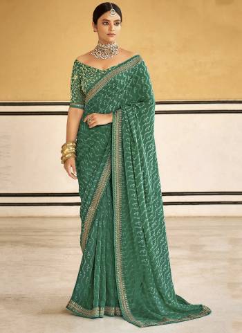 Look These Saree in Fine Colored.These Saree Are Georgette And Blouse is Fabricated On Dupion Pair.Its Beautified With Designer Bandhni Printed With Embroidery Work Lace Border Blouse.