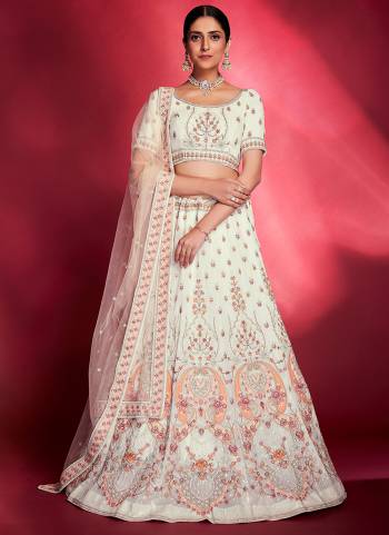 For A Designer Look,Grab These Lehenga Choli in Fine Colored.These Lehenga And Blouse Are Fabricated On Georgette Pair With Soft Net Dupatta.Its Beautified With Thread,Sequance Embroidery,Zarkan Work.